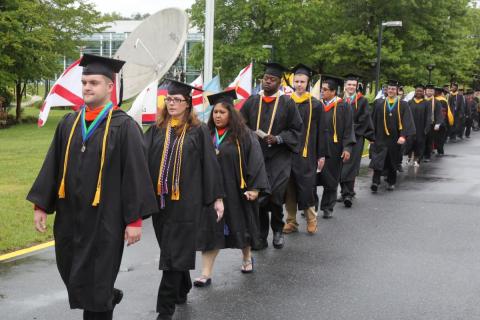 Cap students walk to graduation