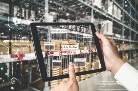 supply chain worker using tablet in warehouse